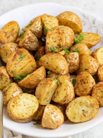 Close up of a bowl of air fried baby potatoes.