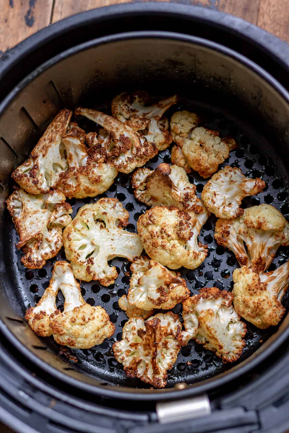 Cooked cauliflower in an air fryer.