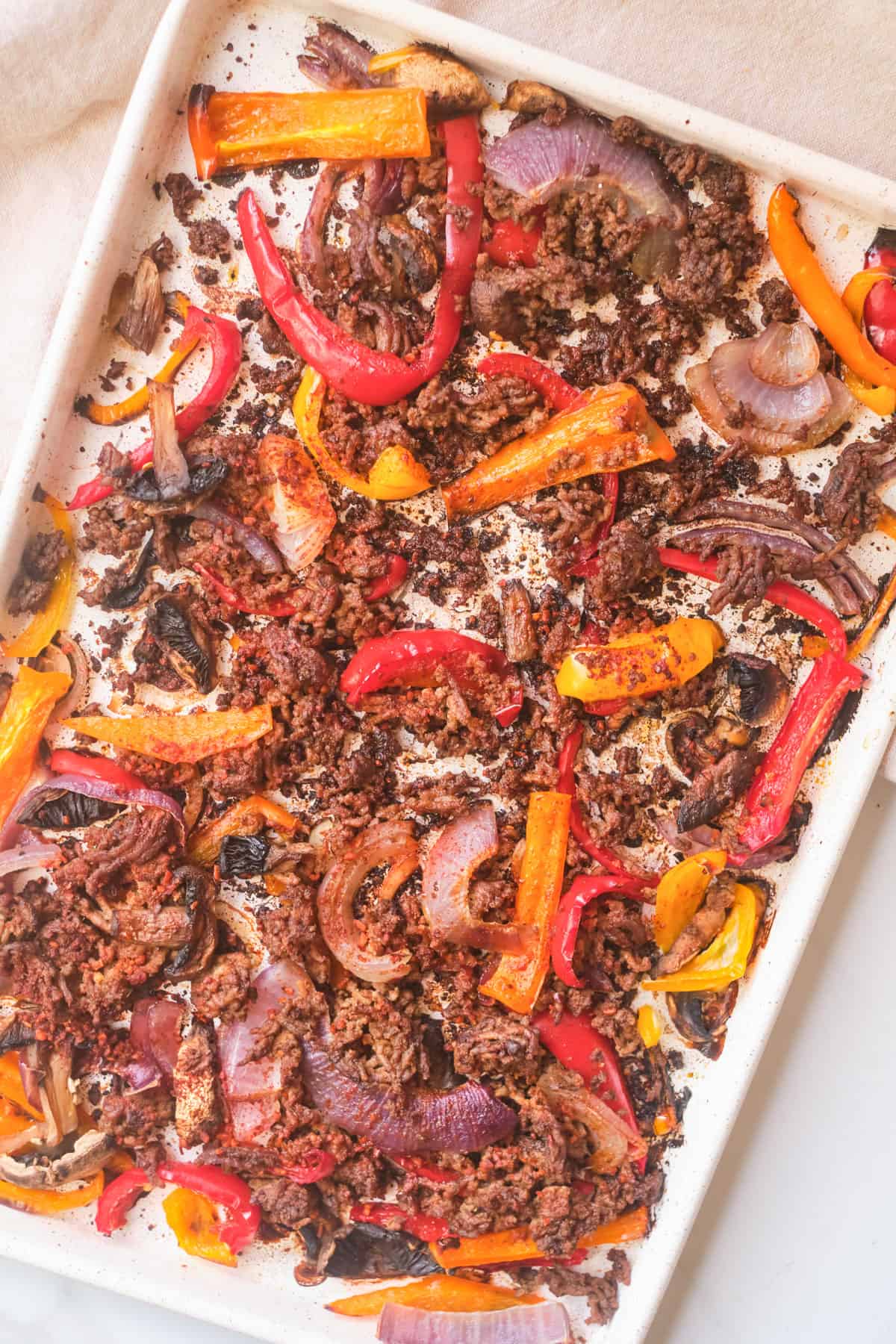 A sheet pan of roasted Mexican ground beef and peppers.
