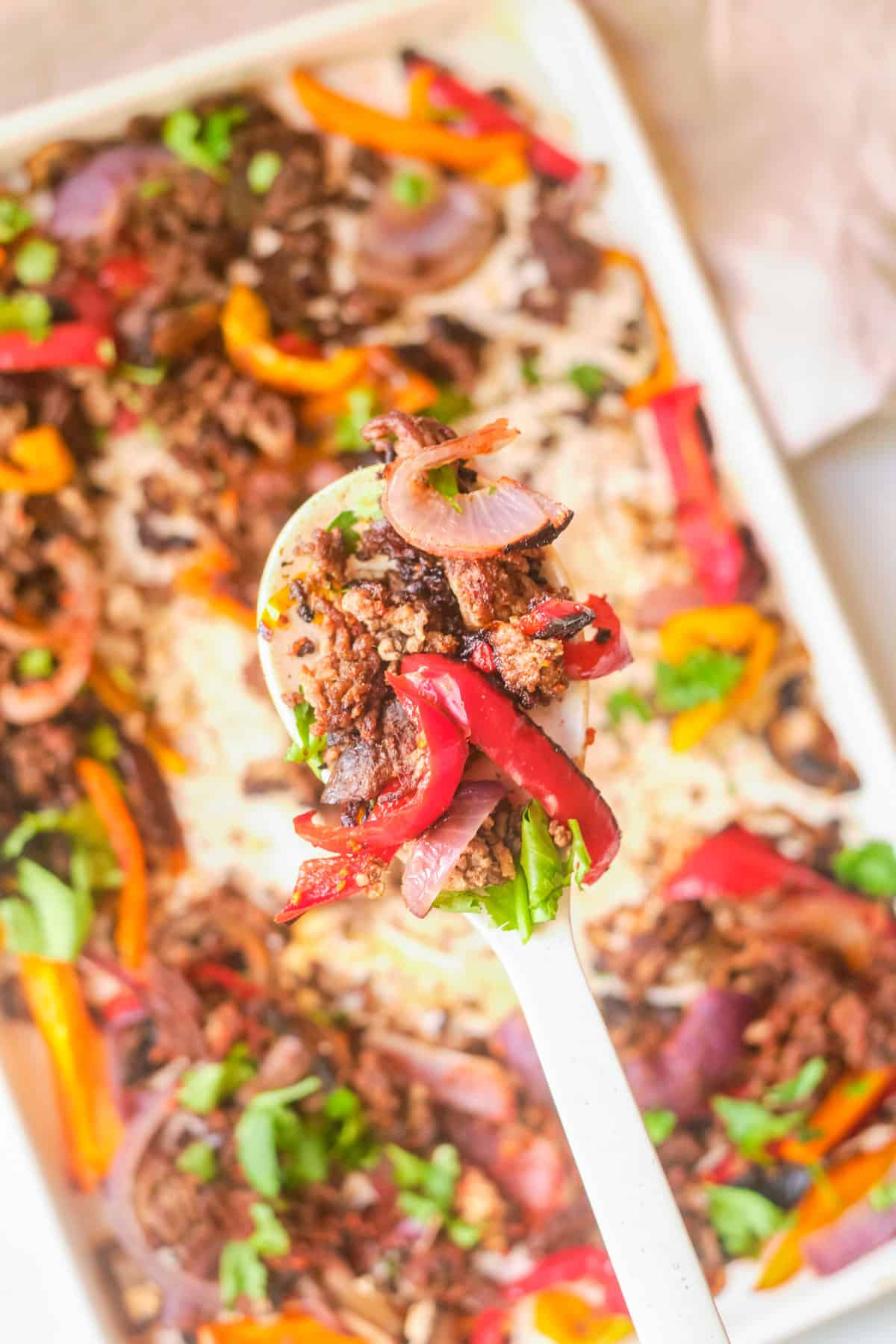 A spoonful of sheet pan Mexican ground beef and peppers.