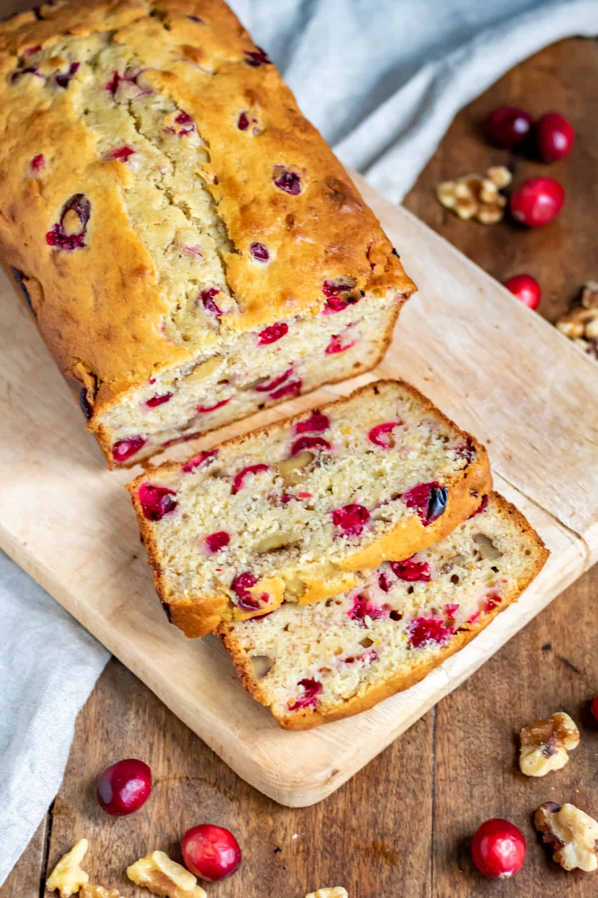 Looking down at a cranberry banana bread with slices next to it.