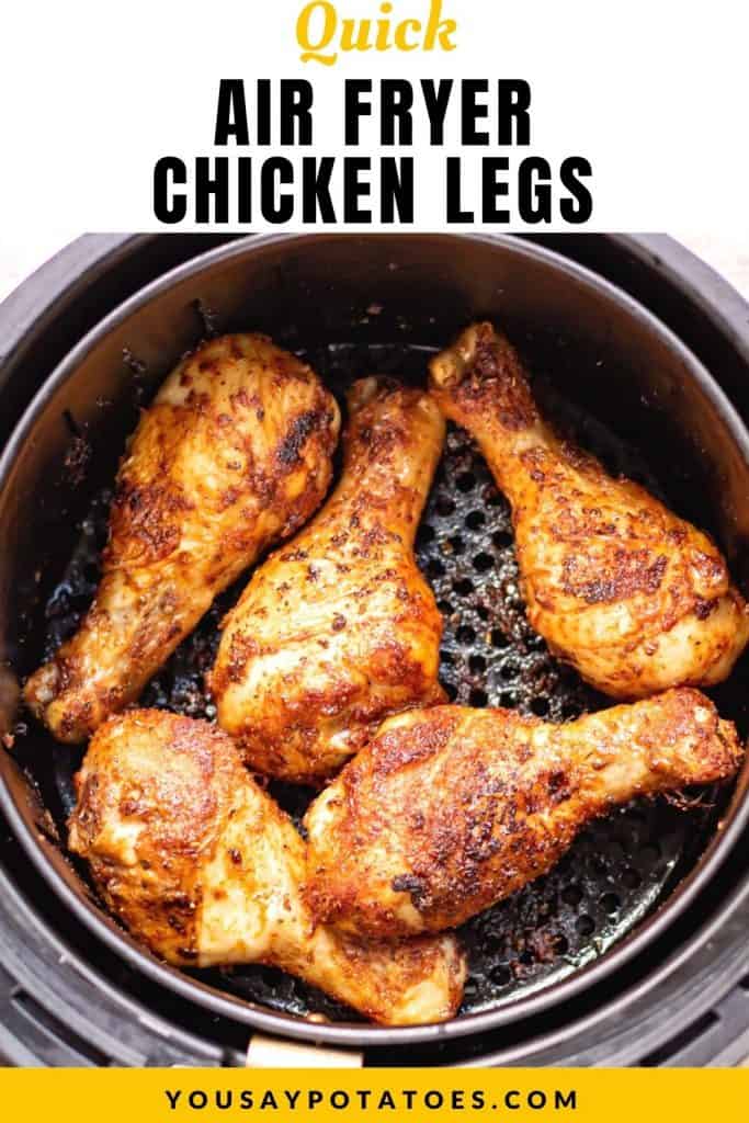 Air fryer with cooked drumsticks, with text: Quick air fryer chicken legs.