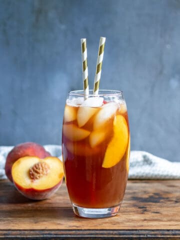 Glass of iced tea with peaches.