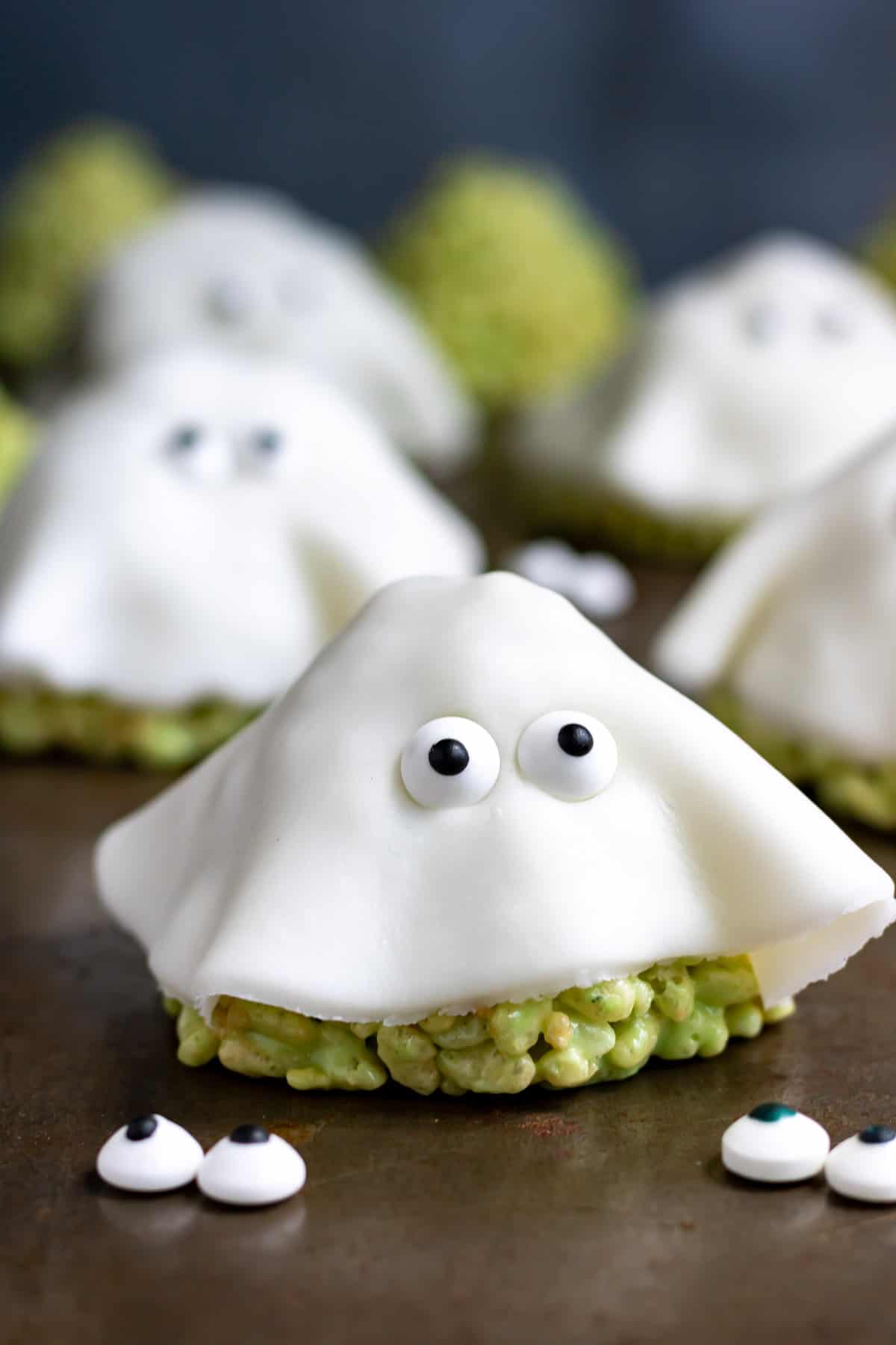 A rice krispie treat draped in white fondant with candy eyes - to look like a ghost.