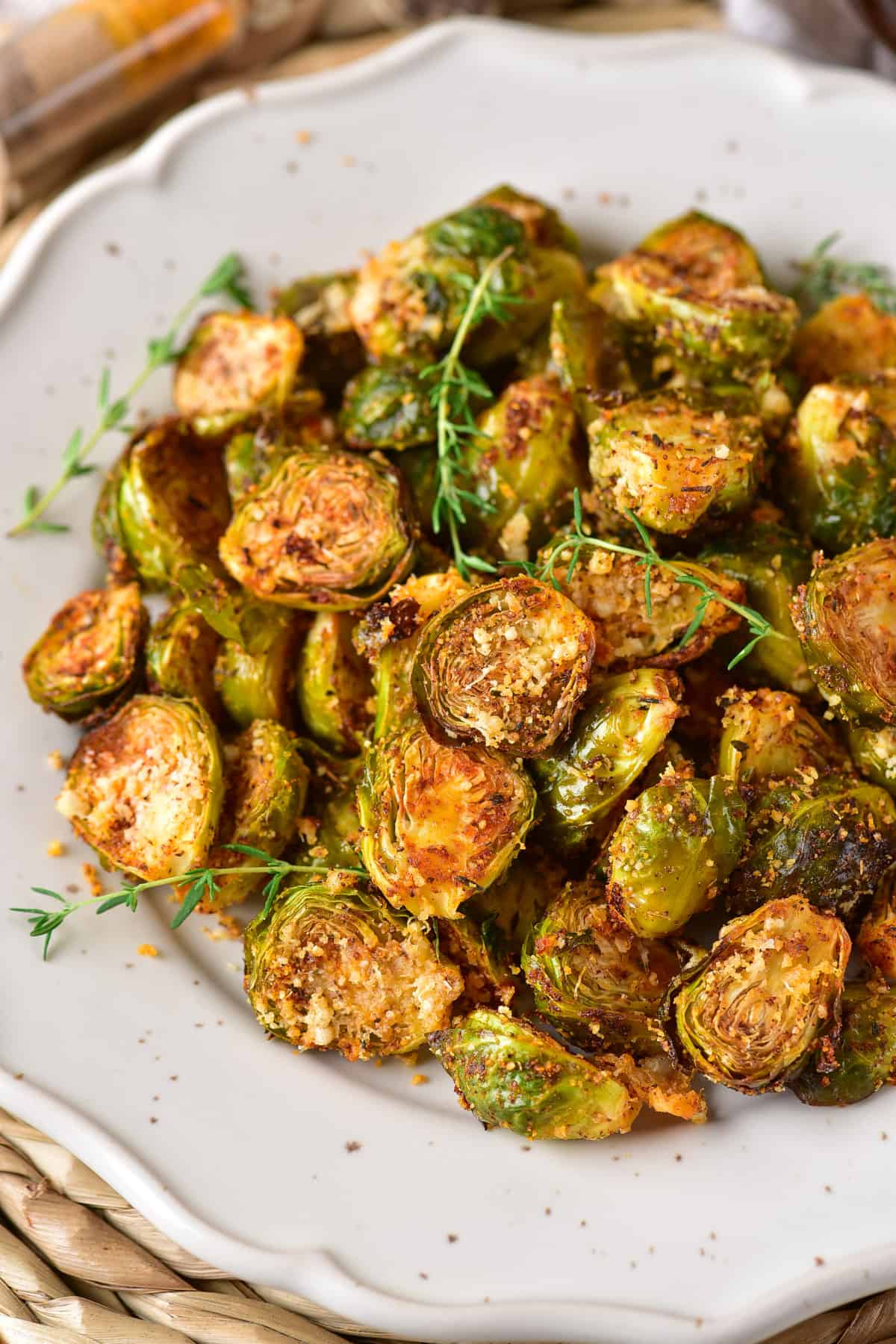 A pile of parmesan brussels sprouts on a plate.