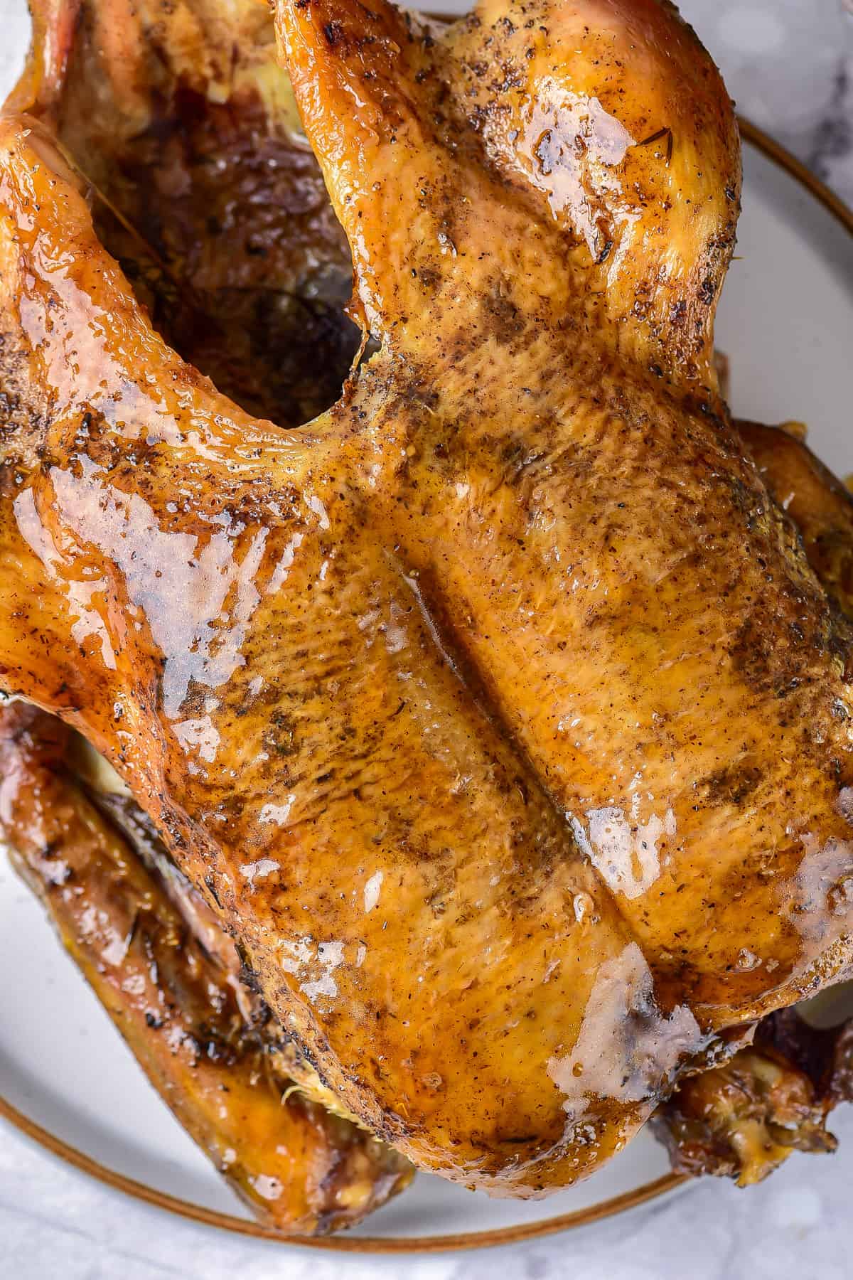 Close up of a glazed roast duck.