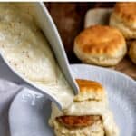 Pouring white gravy onto biscuits, with text: Easy milk gravy white country gravy.
