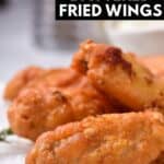 Plate of wings, with text: Crispy Battered Fried Wings.