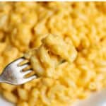 Forkful of pasta, with text: Easy Cheesy Microwave Mac and Cheese.