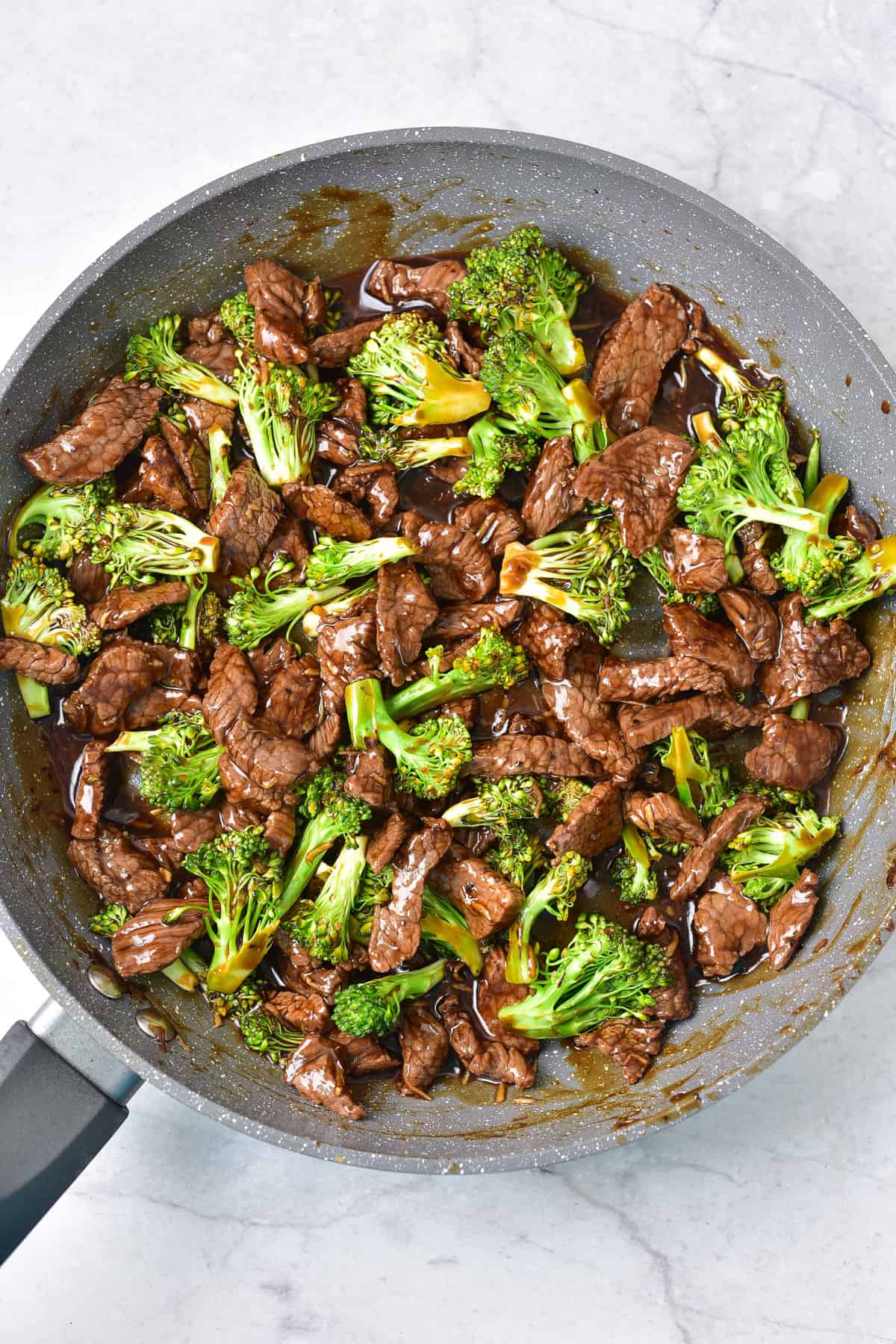 Beef and broccoli simmering in the sauce.