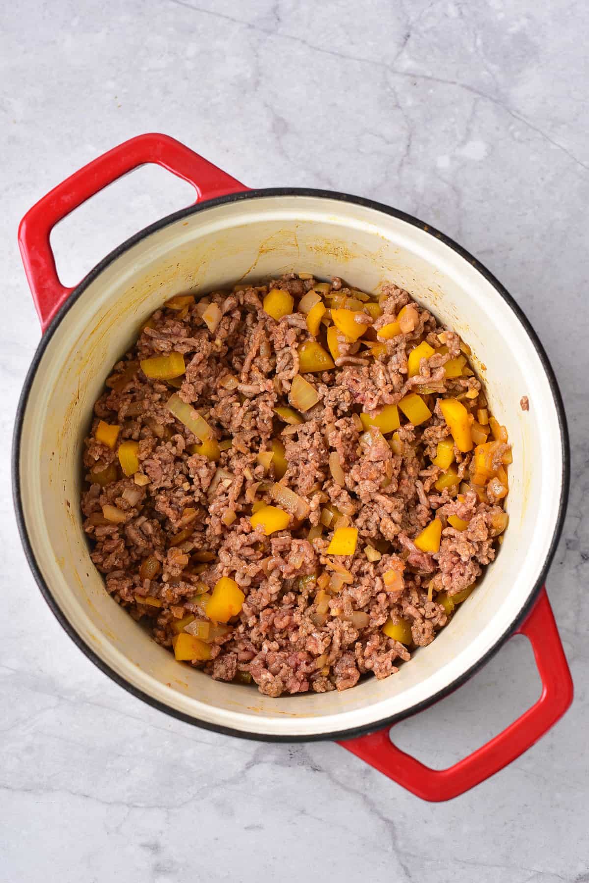 Ground beef cooked in the pot.