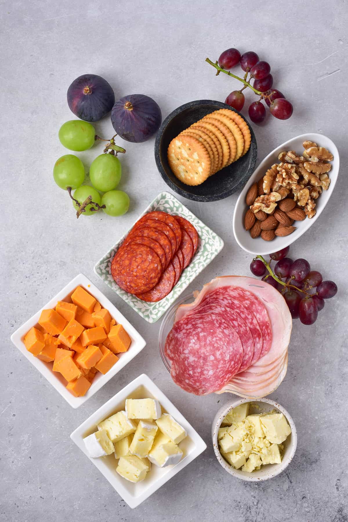 Ingredients for a meat and cheese tray.