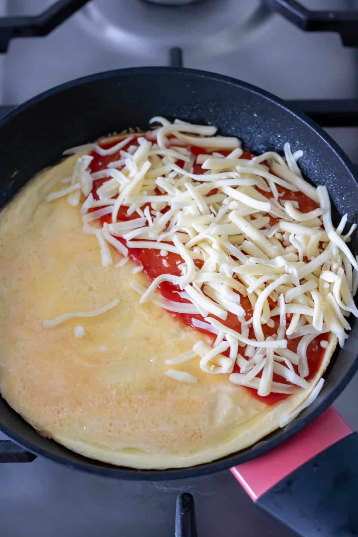 Mozzarella added to the omelet.