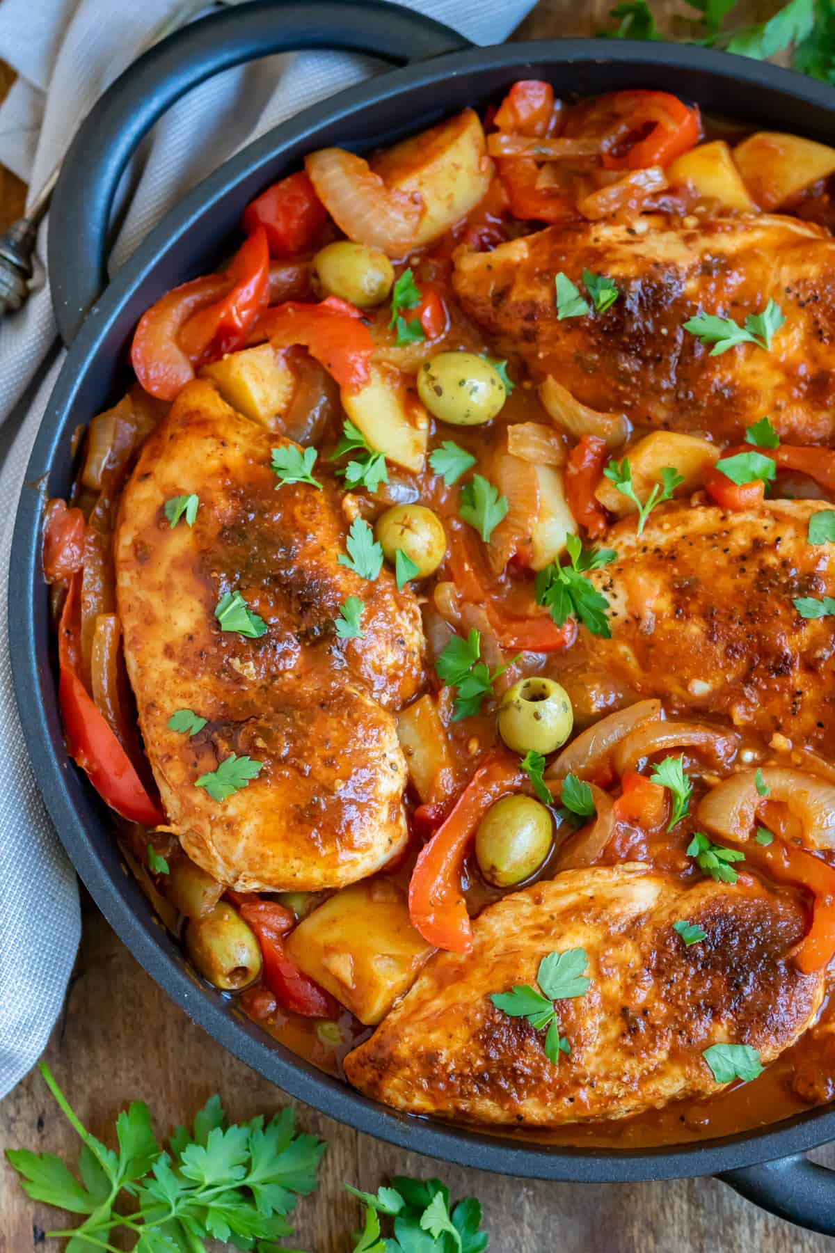 A pot of Spanish chicken breasts on a table.