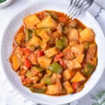 Looking down at a bowl of zucchini stew.