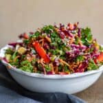 Side view of a bowl of asian cabbage salad.
