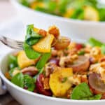 A forkful of fried apple salad.