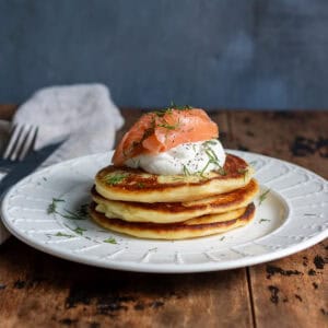 Stack of mashed potato pancakes on a plate.