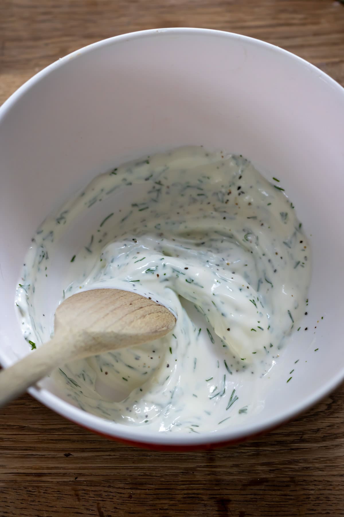Mixing the dressing.