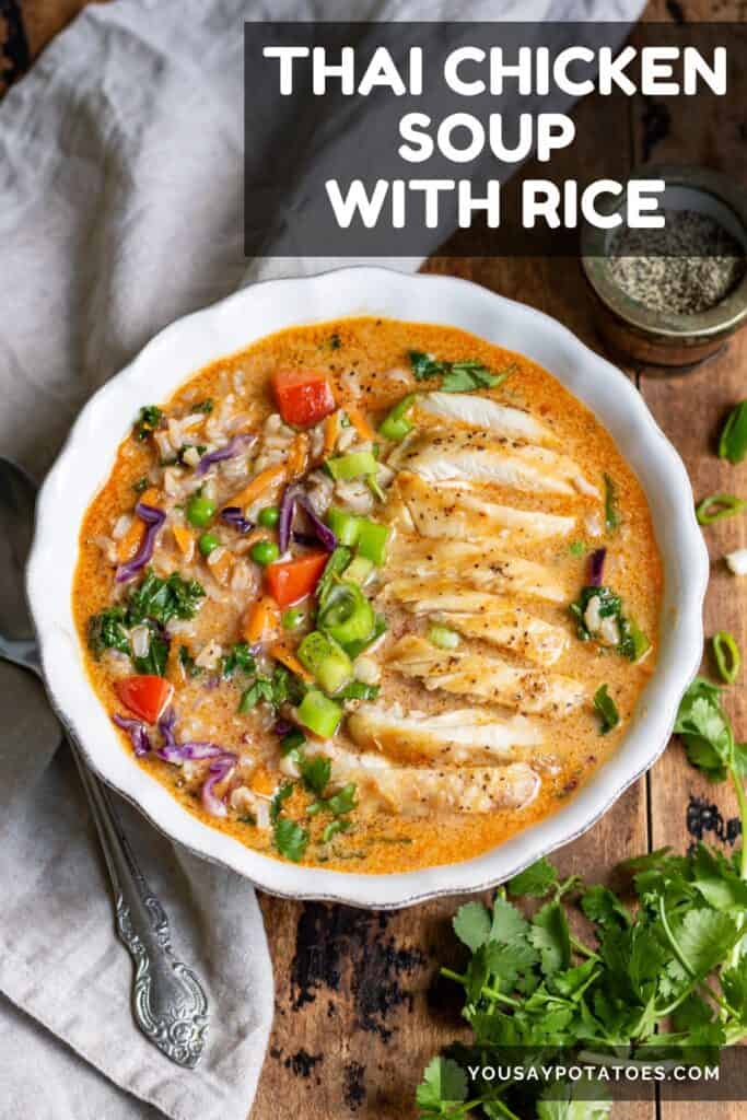 Bowl of soup on a table, with text: Thai Chicken Soup with Rice.