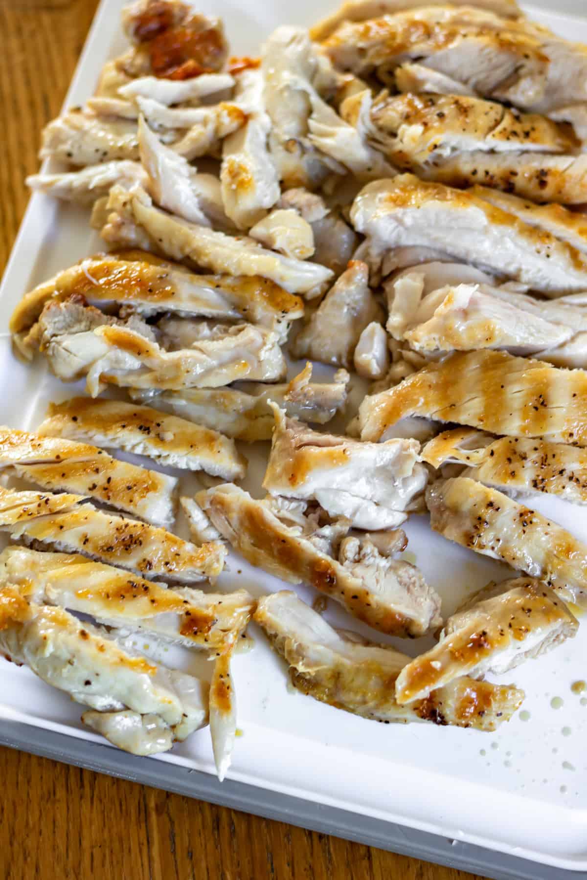 Sliced grilled chicken thighs.