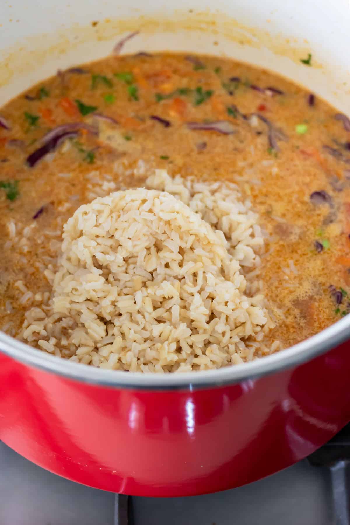 Cooked brown rice added to the pot.