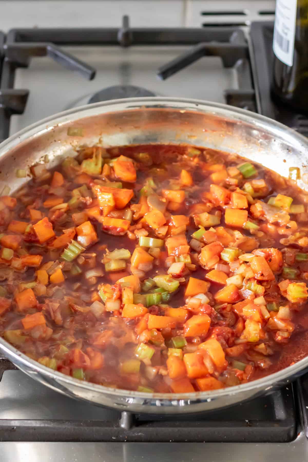 Red wine bubbling in the soffritto.