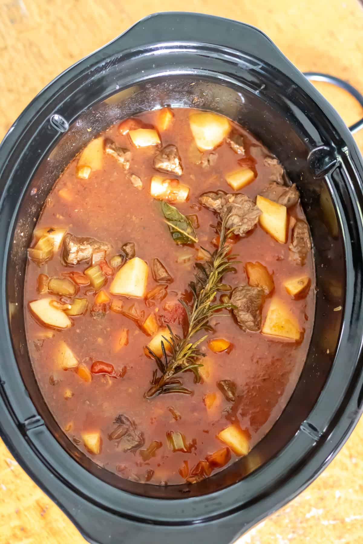 Partially cooked slow cooker spezzatino Italian beef stew.
