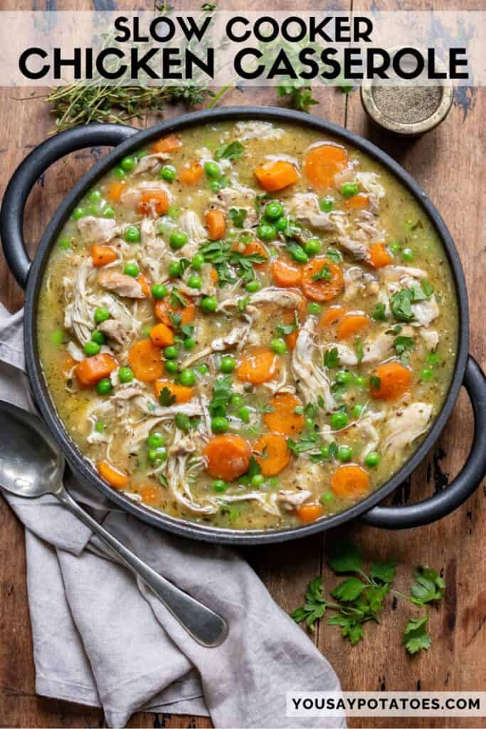 A serving dish of casserole on a wooden table, with text: Slow Cooker Chicken Casserole.