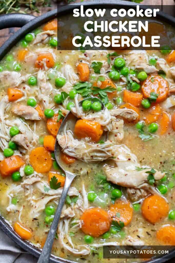 Close up of casserole with a serving spoon in it, with text: Slow Cooker Chicken Casserole.