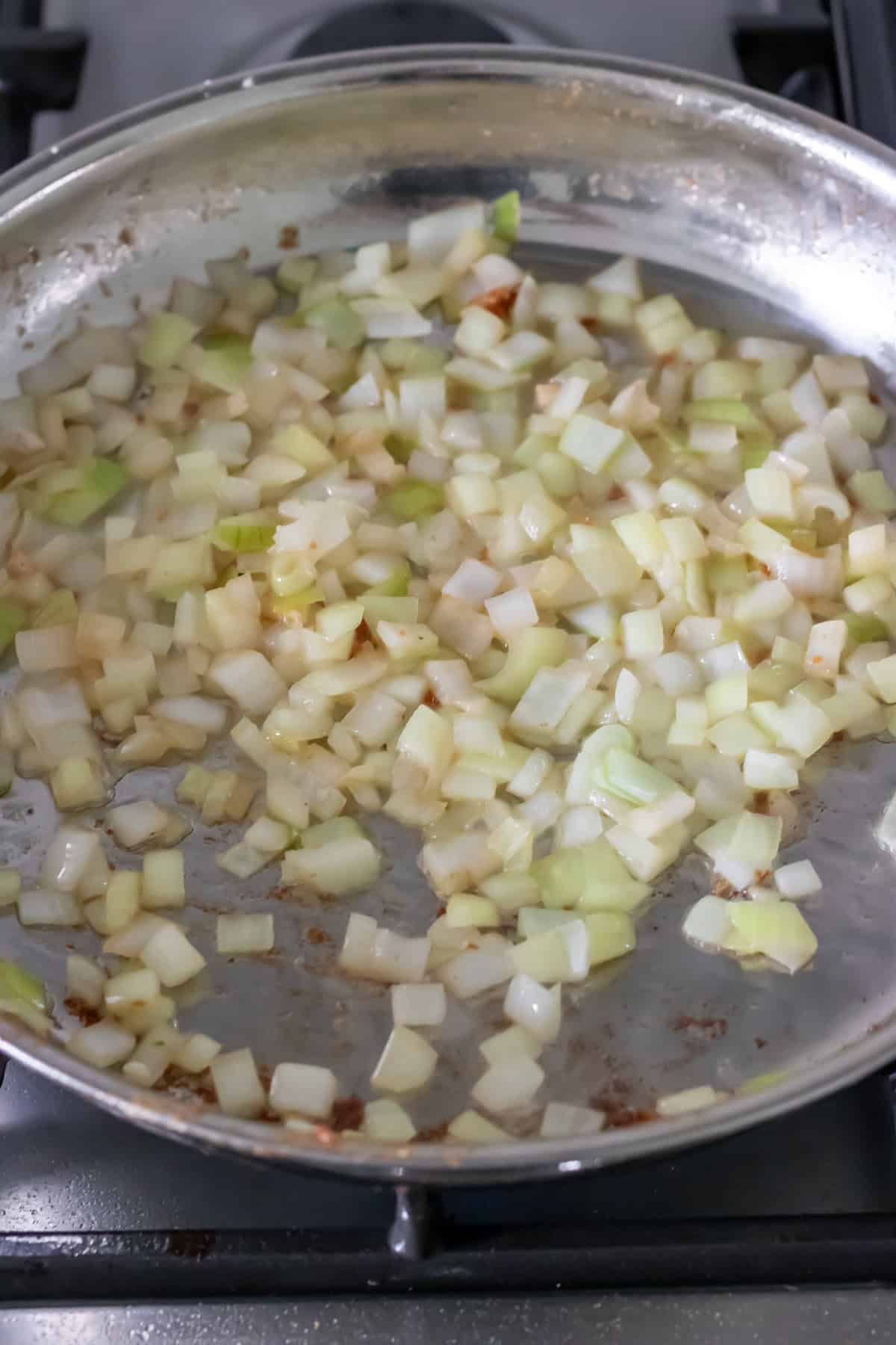 Sauteeing the onion in the skillet.