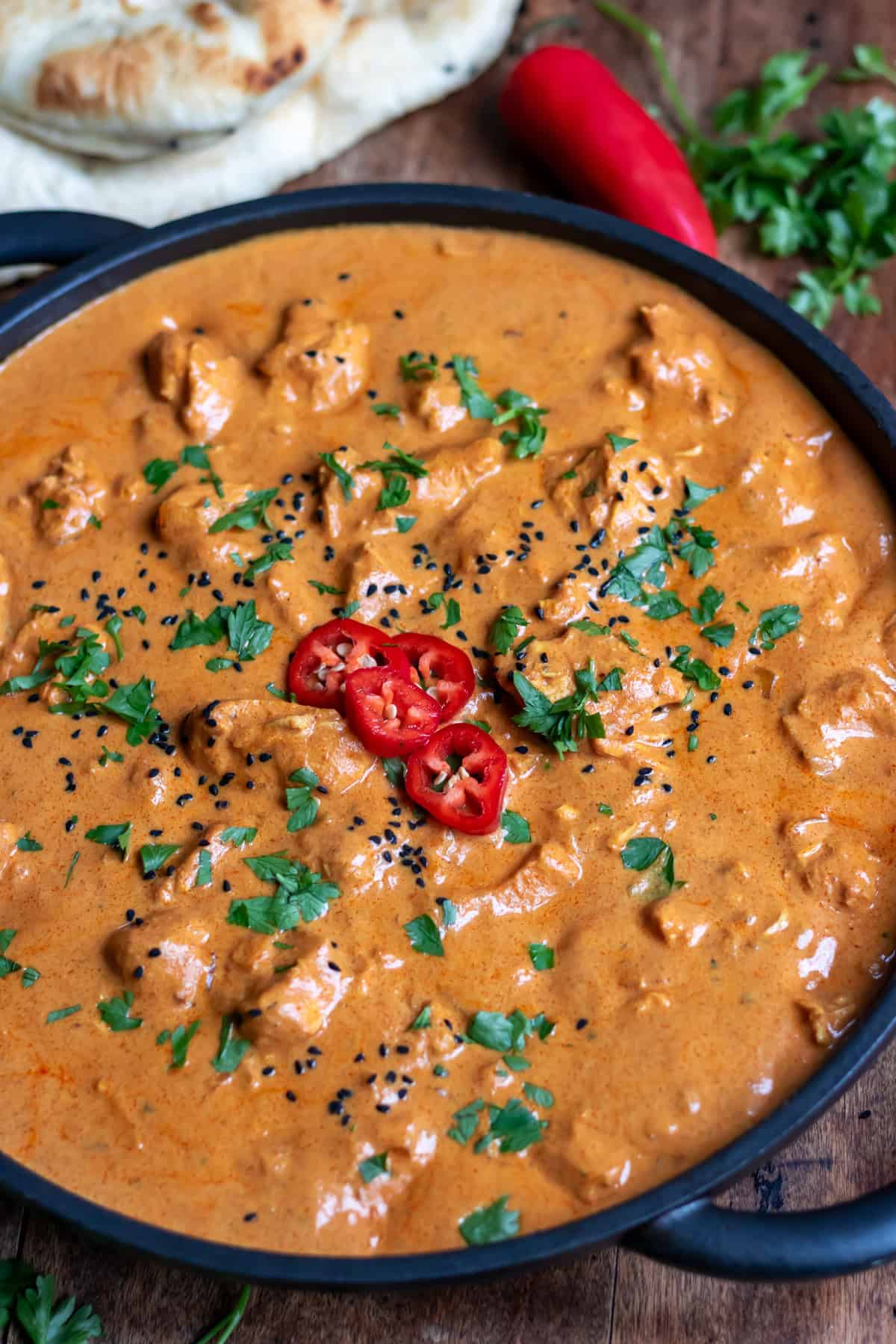 Close up of a serving dish of slow cooker chicken tikka masala.