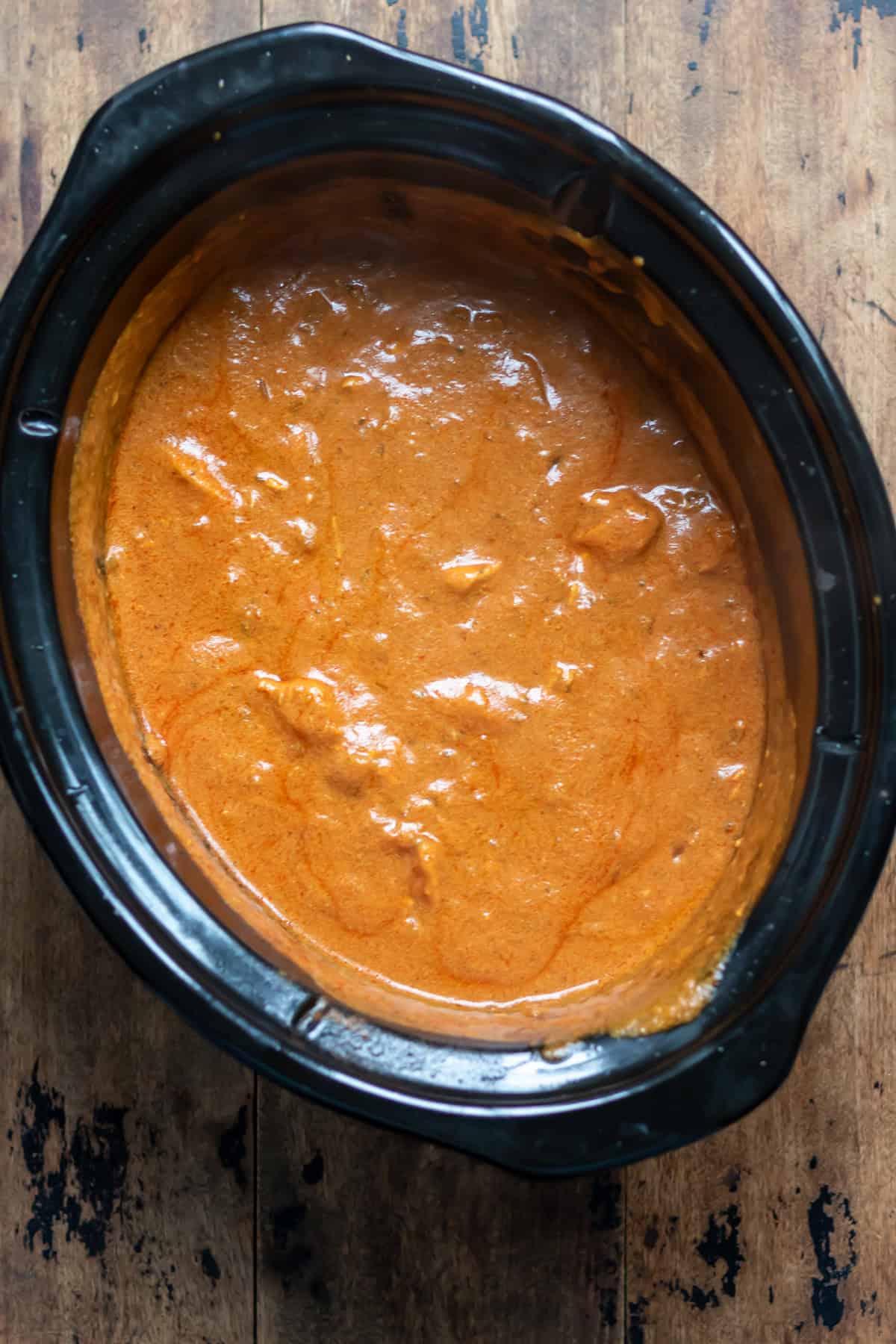 Cooked slow cooker chicken tikka masala.