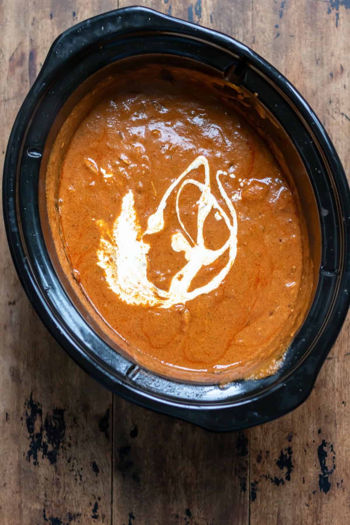 Cream added to the slow cooker.