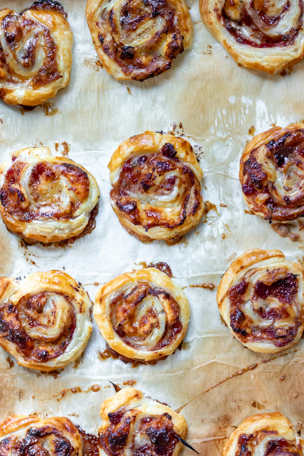 Close up of baked cranberry brie pinwheels.