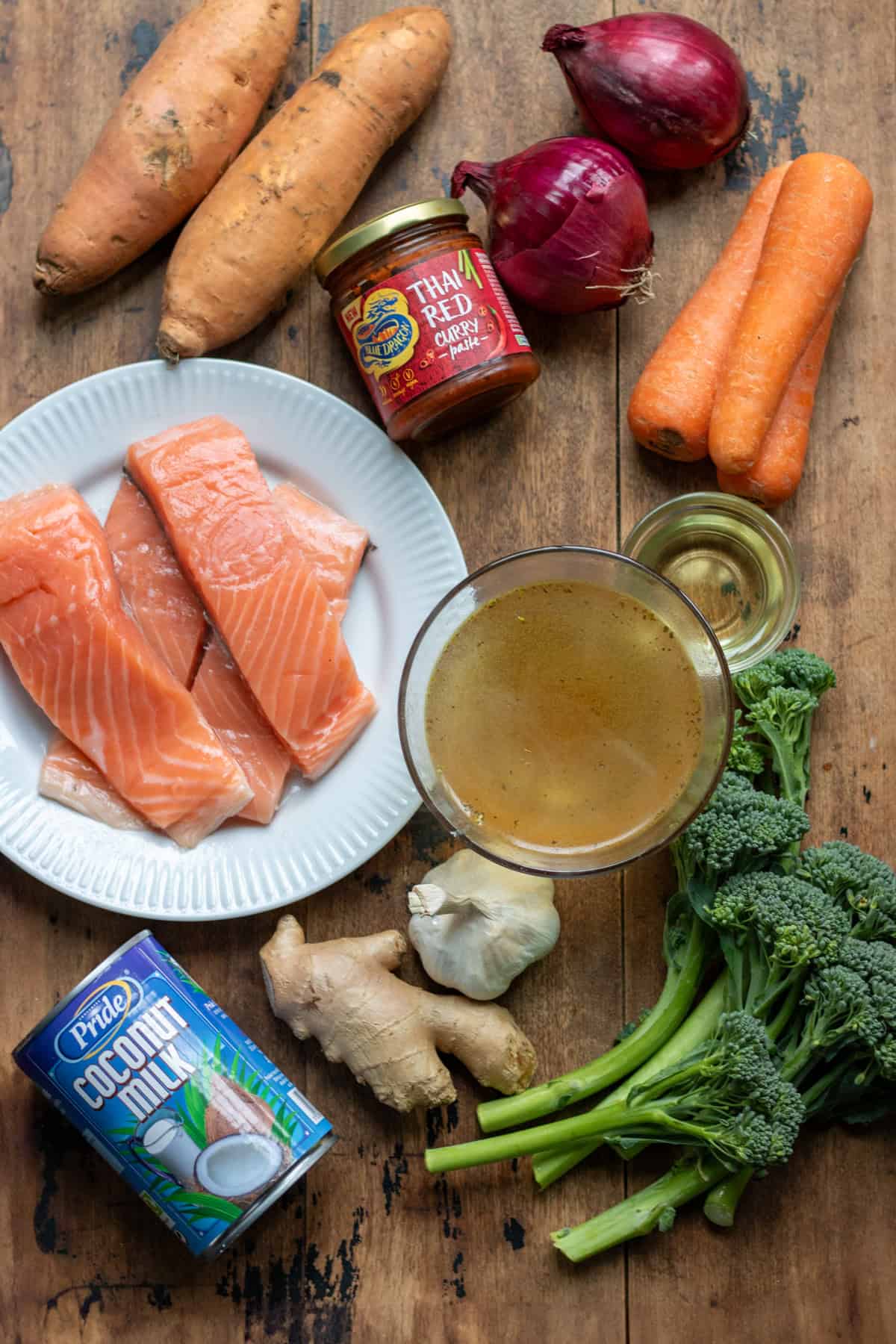 Ingredients for baked Thai salmon and vegetables on a table.