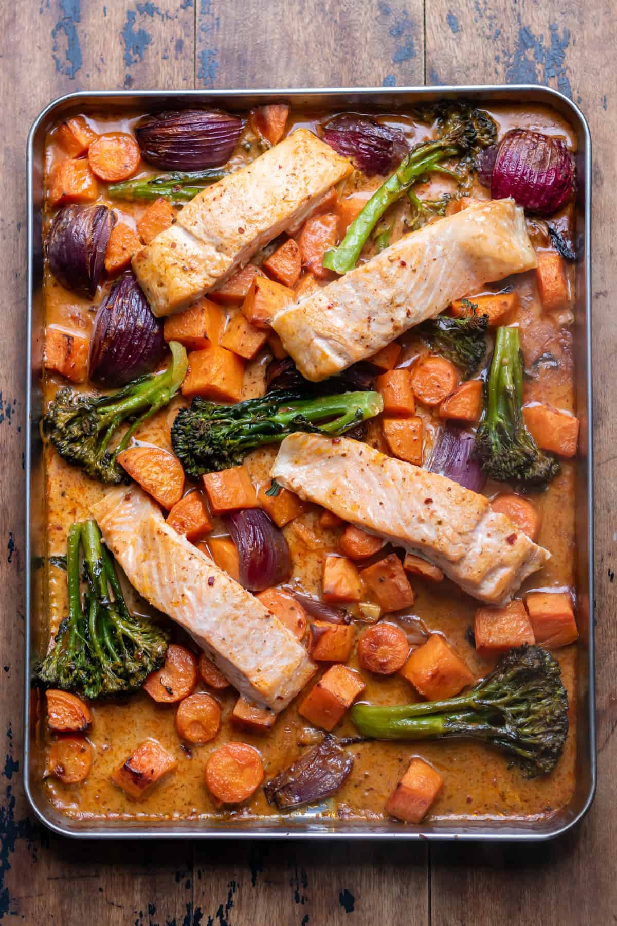 Baked Thai salmon and vegetables on a sheet pan.