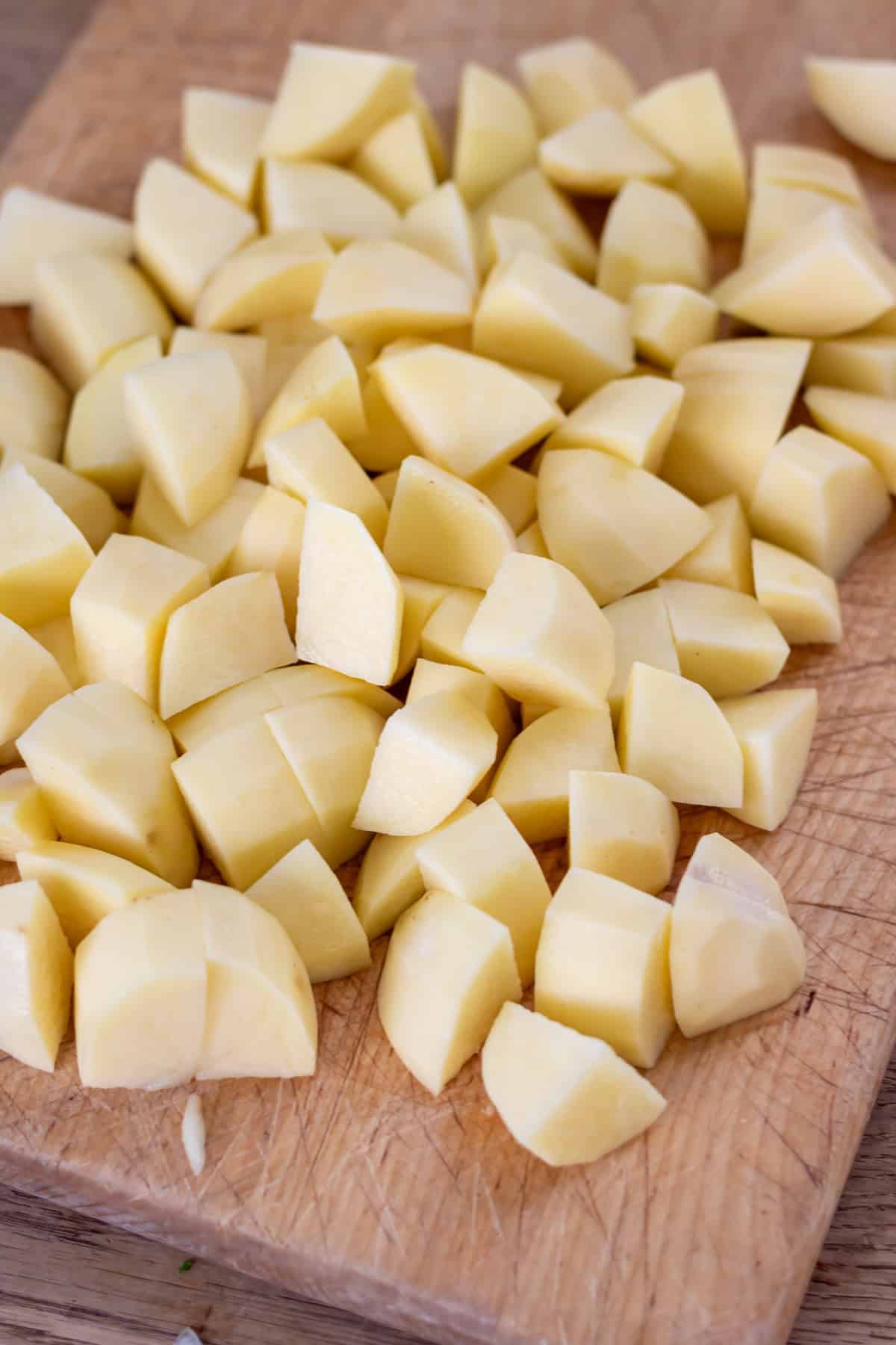Chopping potatoes.