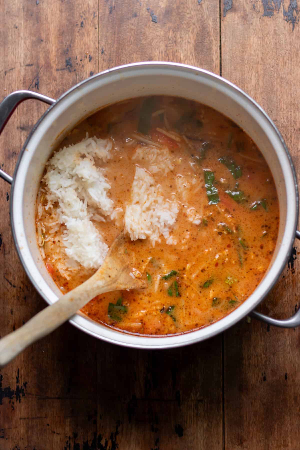 Cooked rice added to the thai soup.