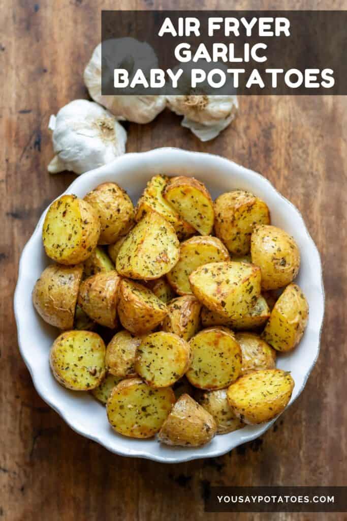 Dish of roasted potatoes with text: Air Fryer Garlic Baby Potatoes.