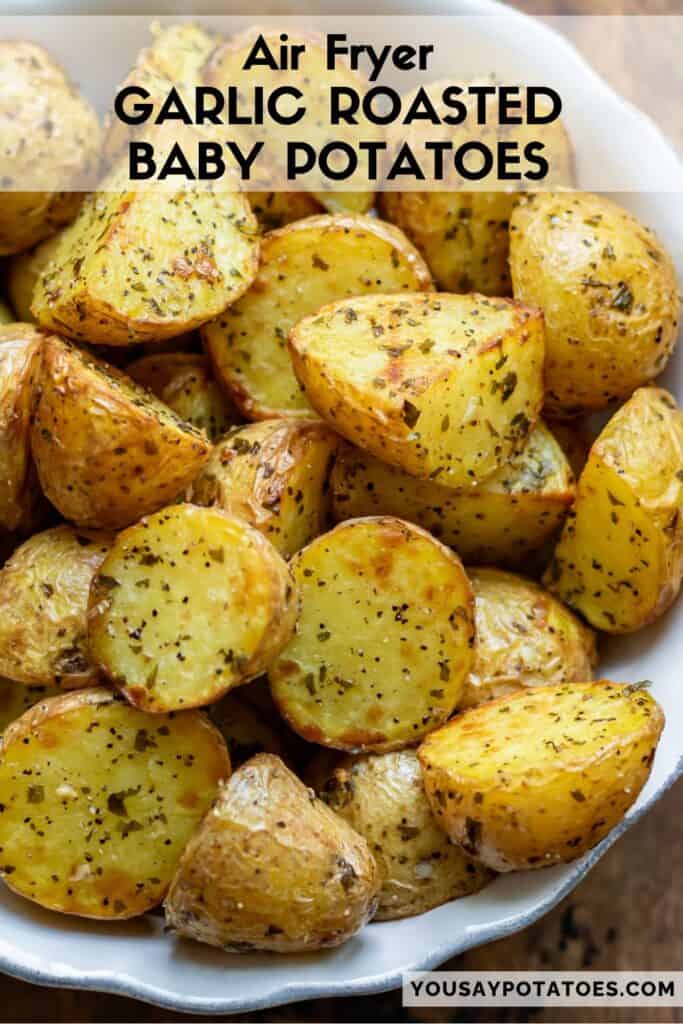 Bowl of potatoes, with text: Air Fryer Garlic Roasted Baby Potatoes.