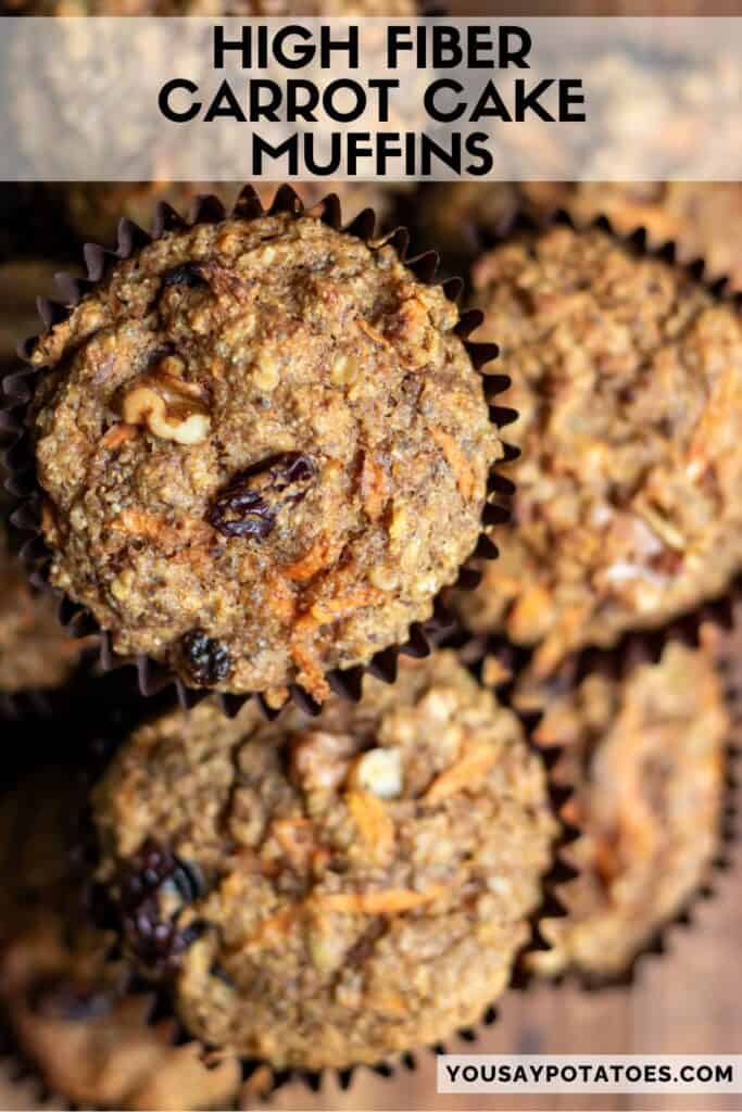 Looking down at a pile of muffins, with text: High Fiber Carrot Cake Muffins.