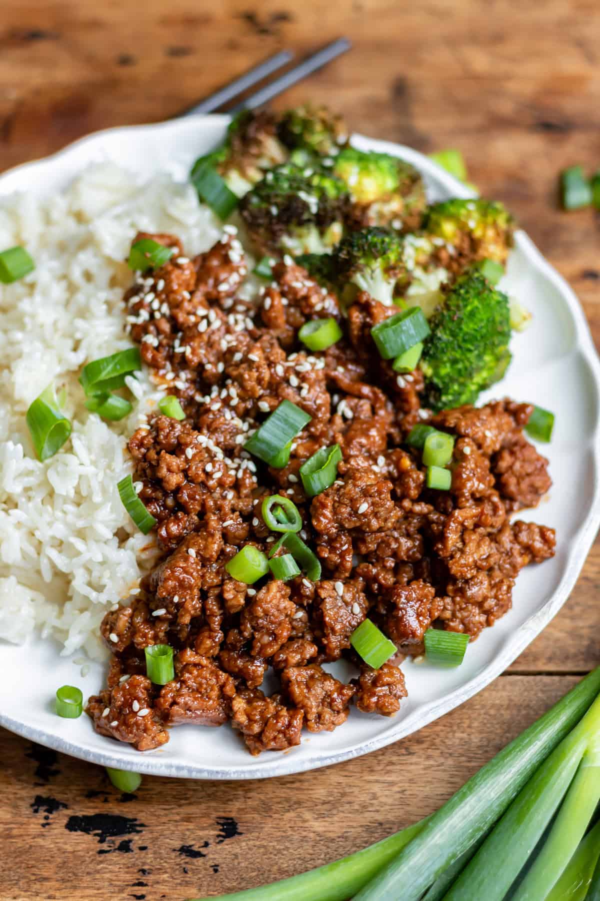 Side view of a plate of rice, broccoli and Korean ground beef.