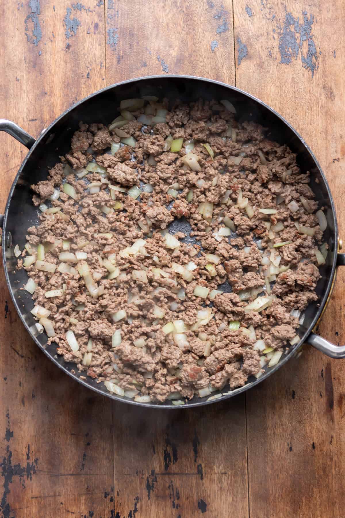 Onions cooked with the ground beef.