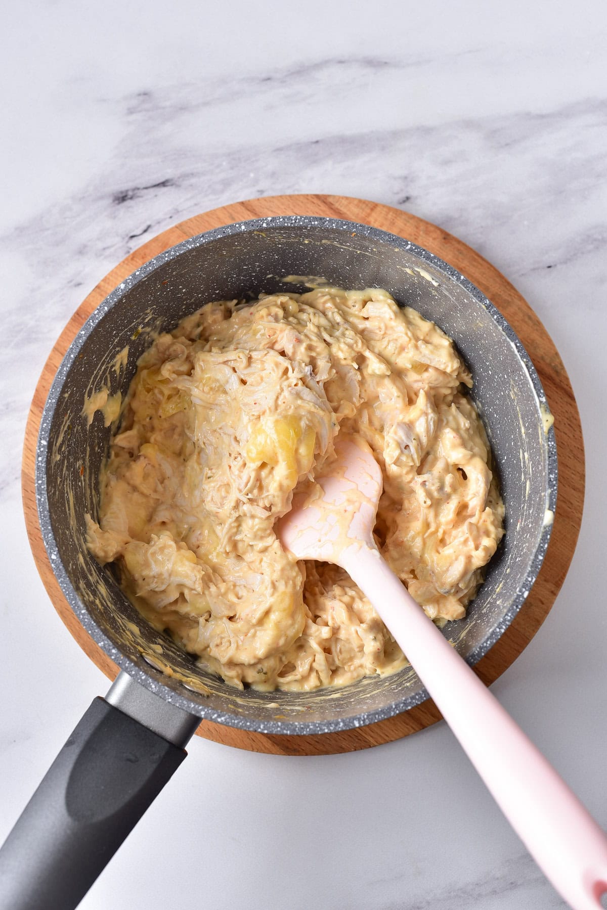 Mixing all the buffalo ranch dip ingredients together.