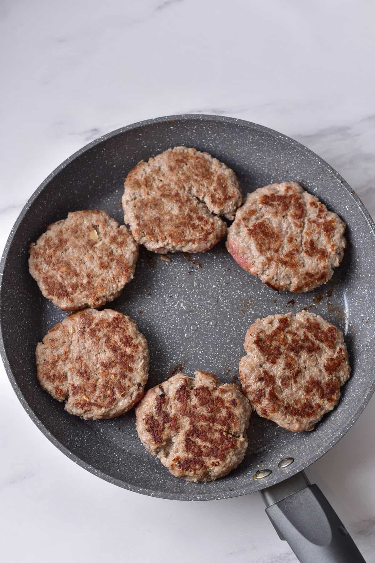 Pan frying the salisbury steaks.