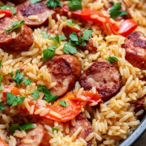 Close up of a dish of kielbasa sausage rice skillet meal.