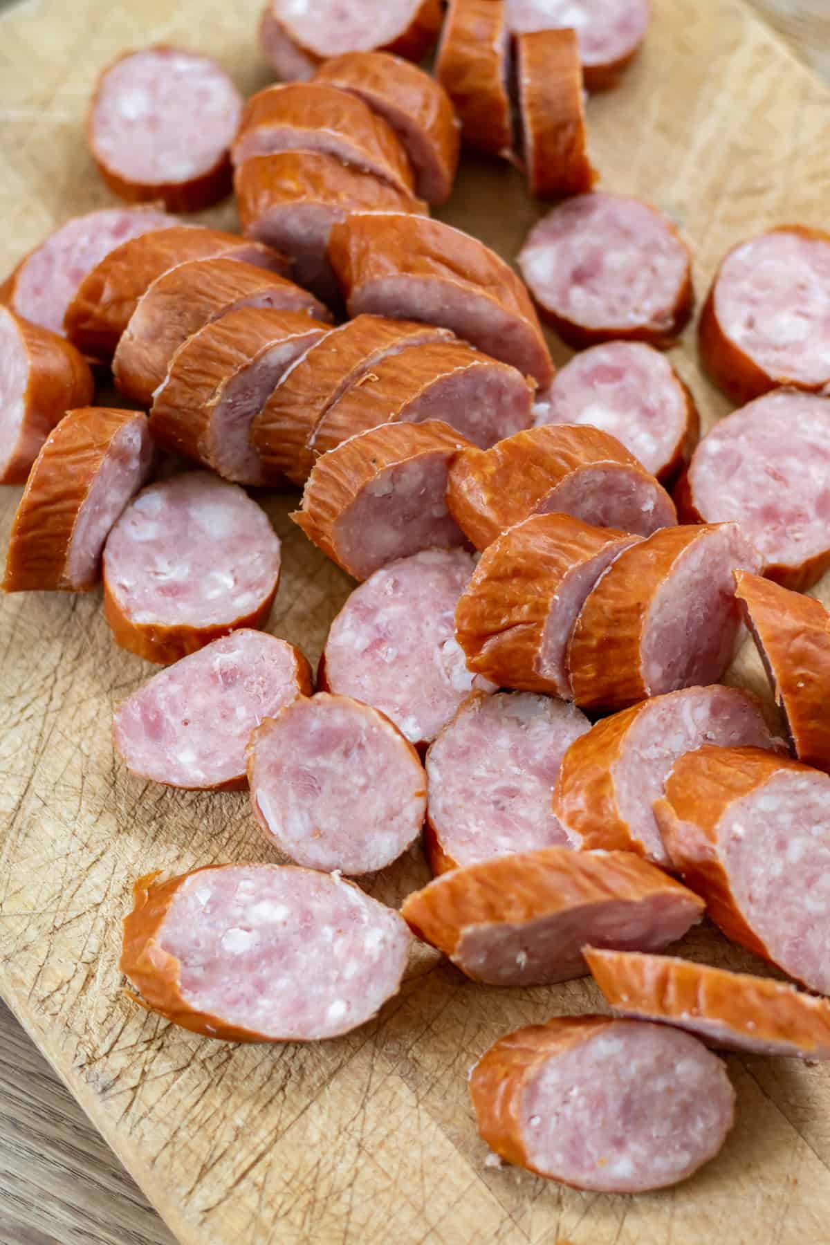 Slicing the kielbasa sausage.