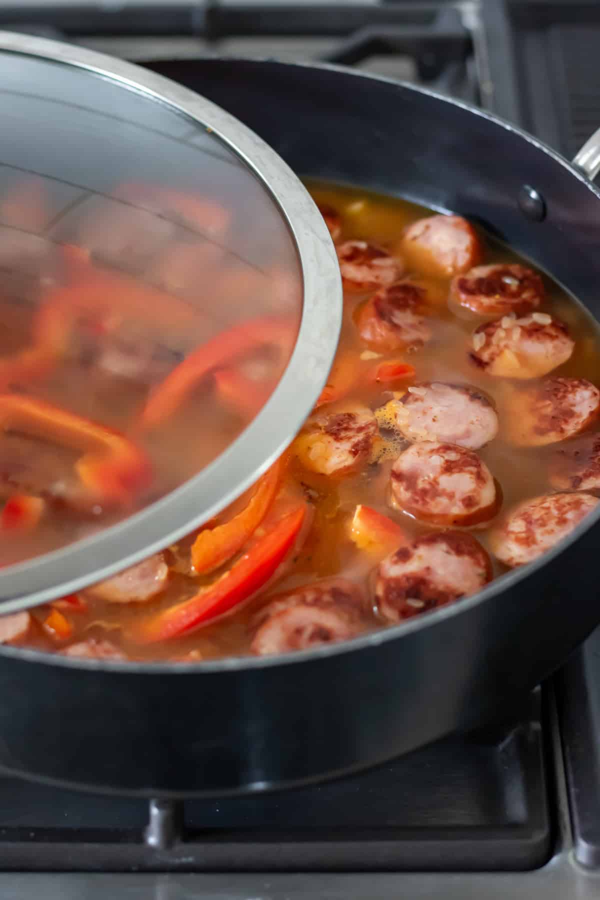 Putting lid on the pan.