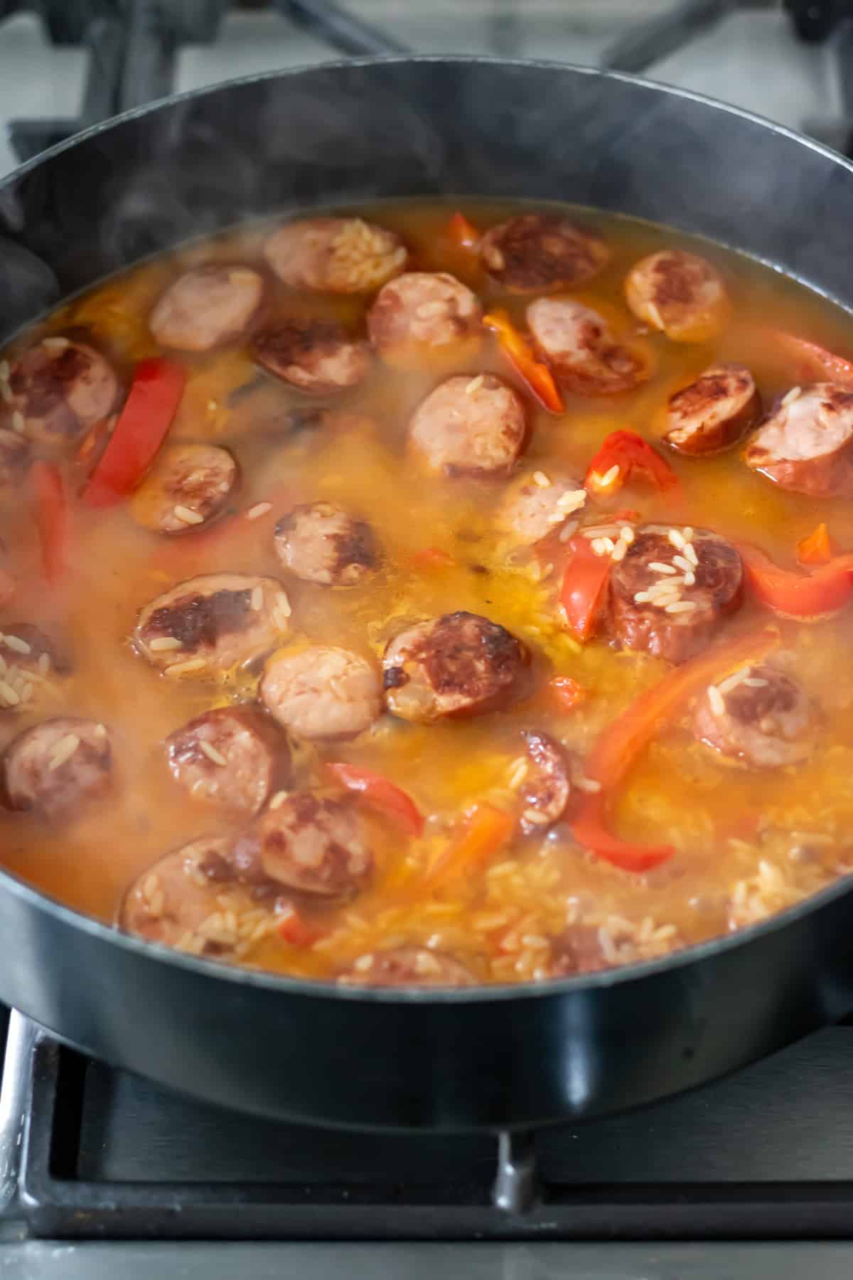 Simmering kielbasa and rice.